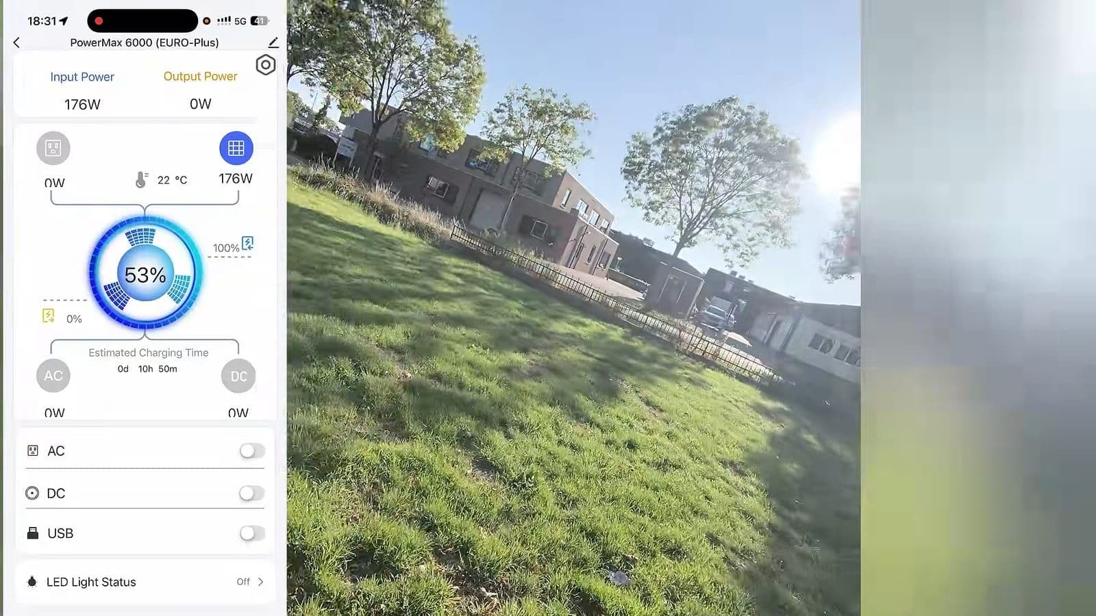App van de PowerMax 6000 met 176 watt zoninvoer en 53% accu naast een grasveld