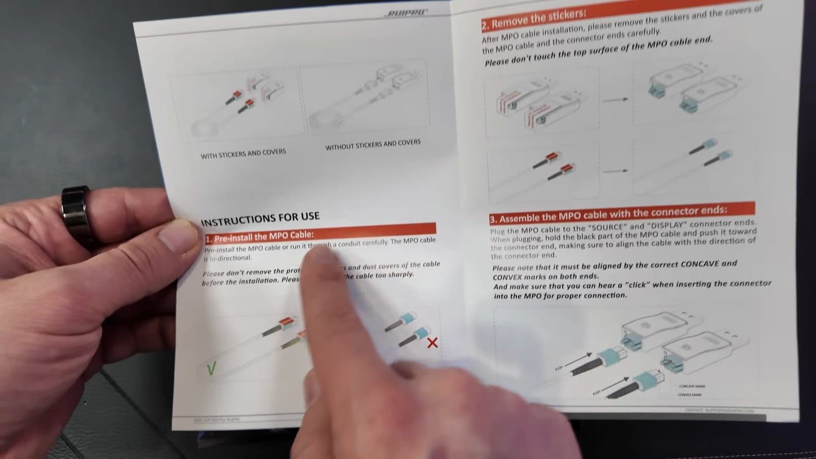 Close-up of user manual showing MPO connector installation steps