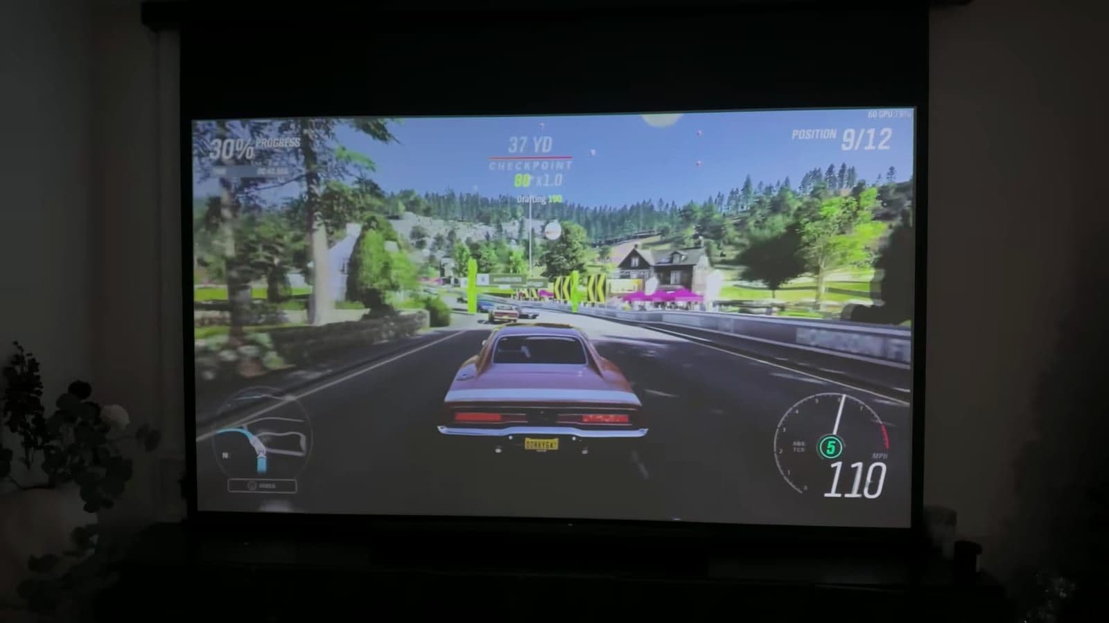 Gaming test running Forza Horizon on a 100-inch projection screen via HDMI